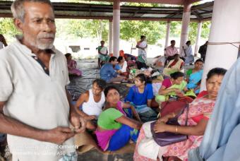 People wait for their first meal of the day