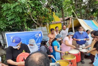 Volunteers ensure wearing full safety gear while serving people