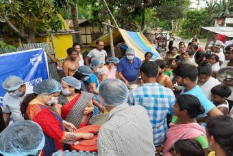 A huge crowd assembles at the serving area