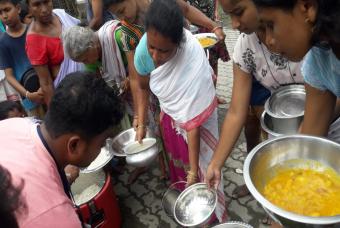 People wait their turn to be served